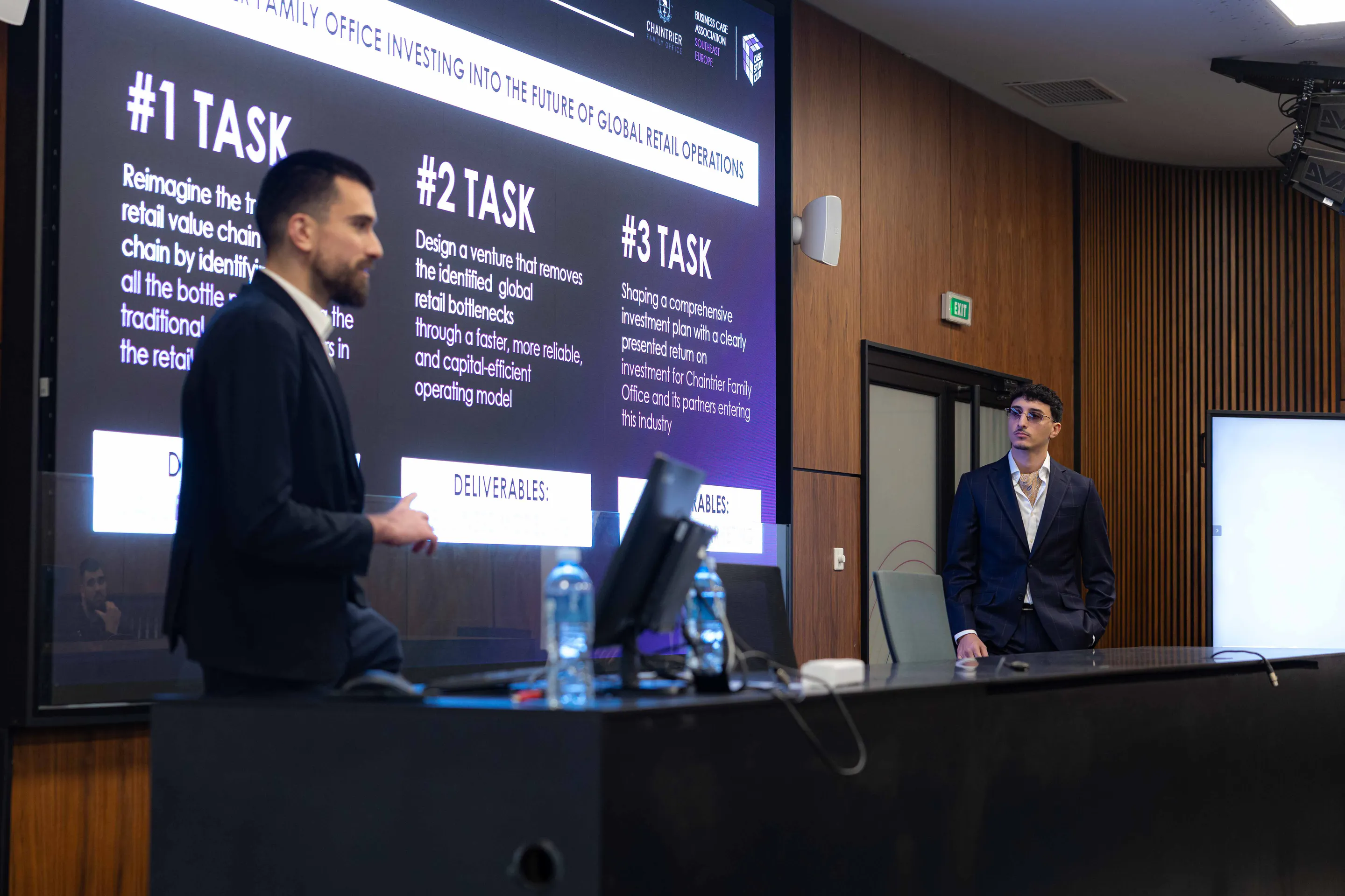 The three case tasks up on screen between two presenters
