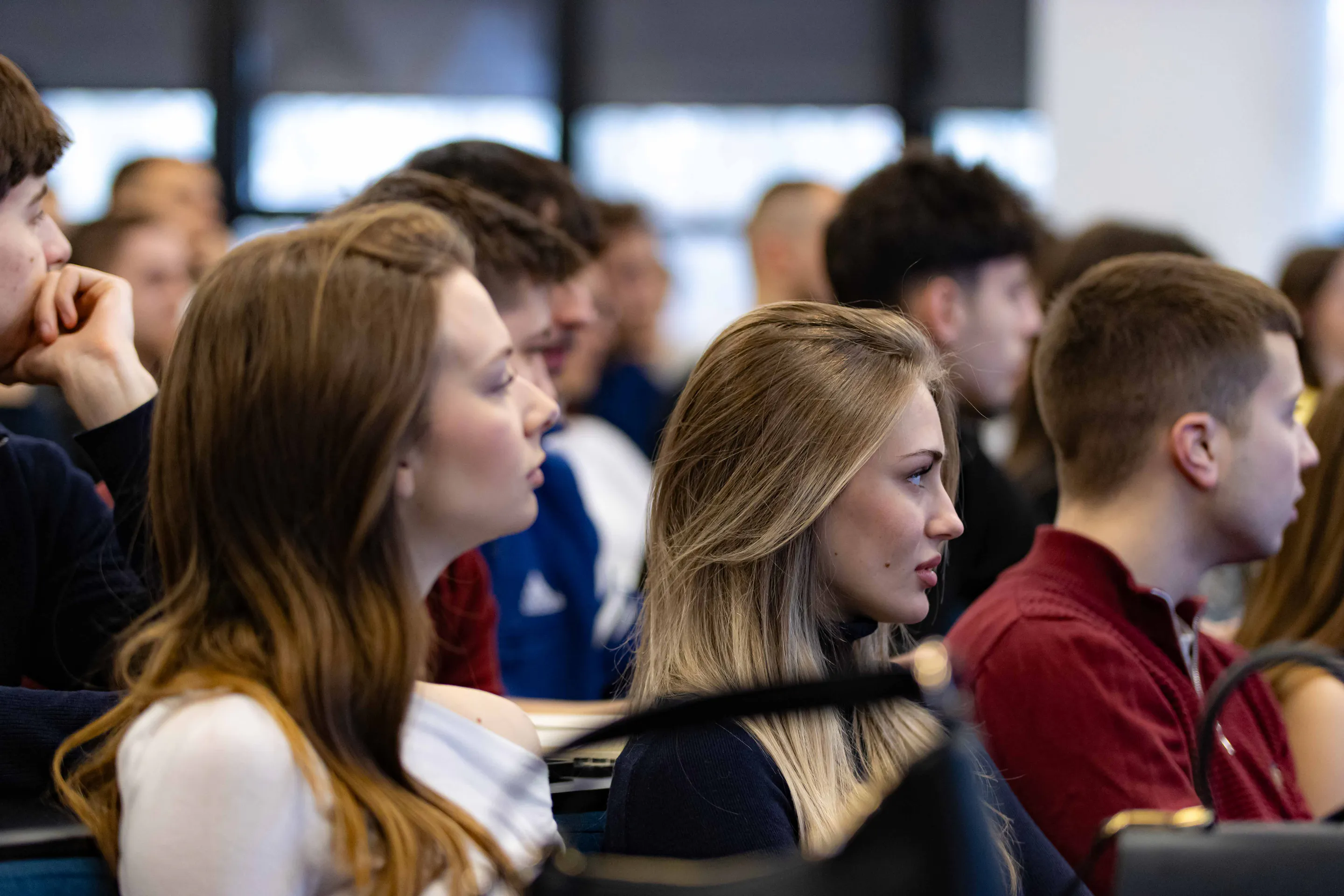 Rows of students following the presentation